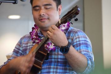 Ukists Kalei Gamiao, Benny Chong, and Byron Yasai performed at a ukulele workshop.
